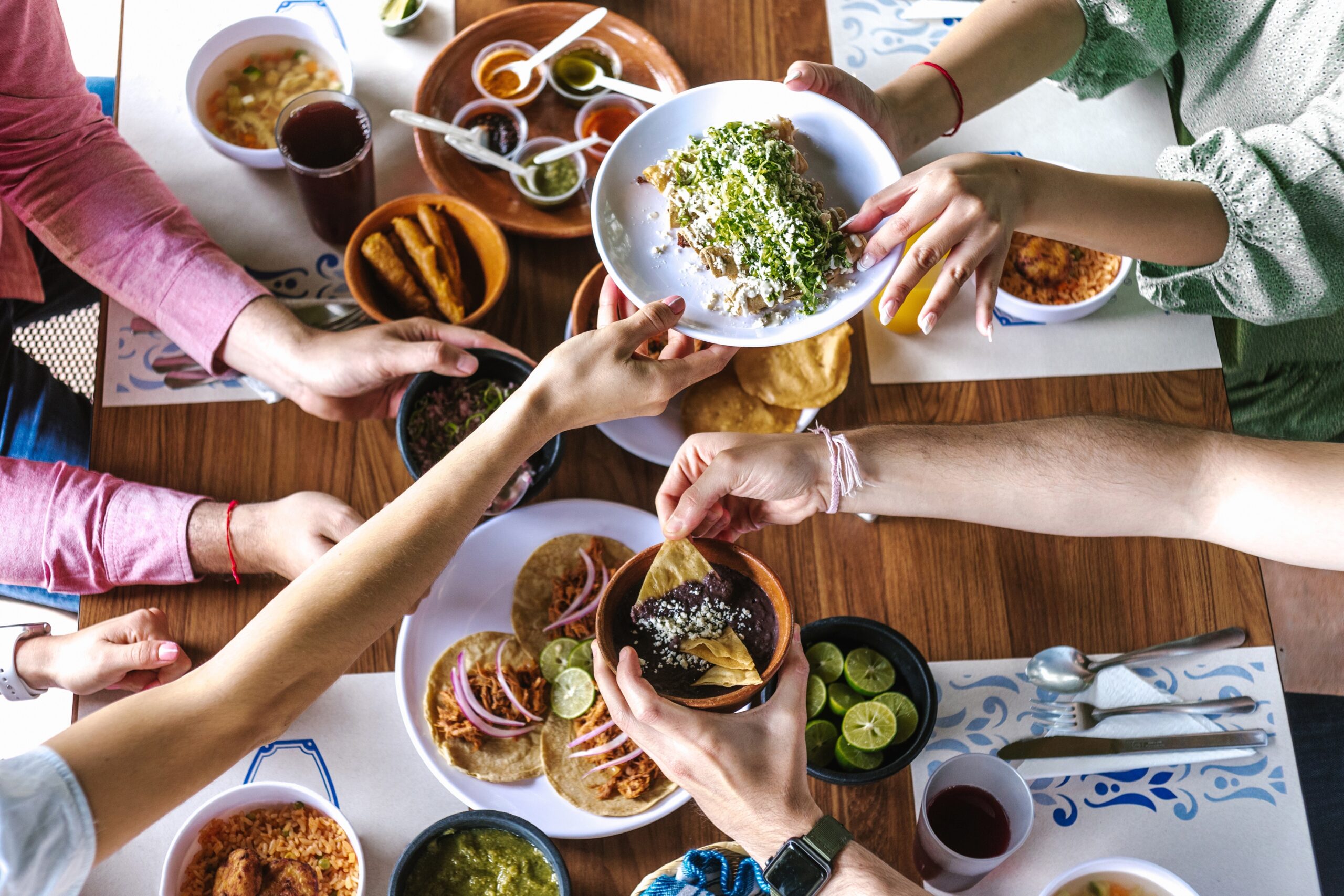 Group,Of,Friend,Eating,Mexican,Tacos,And,Traditional,Food,,Snacks